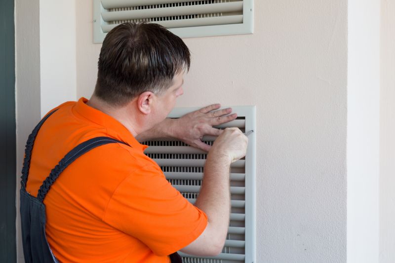 HVAC Technician Servicing Ducts