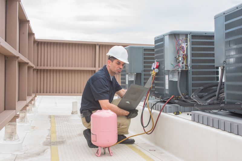Hvac Service Technician Inspecting Equipment